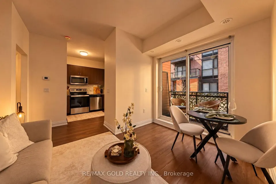 Living room opening to the dining area and balcony