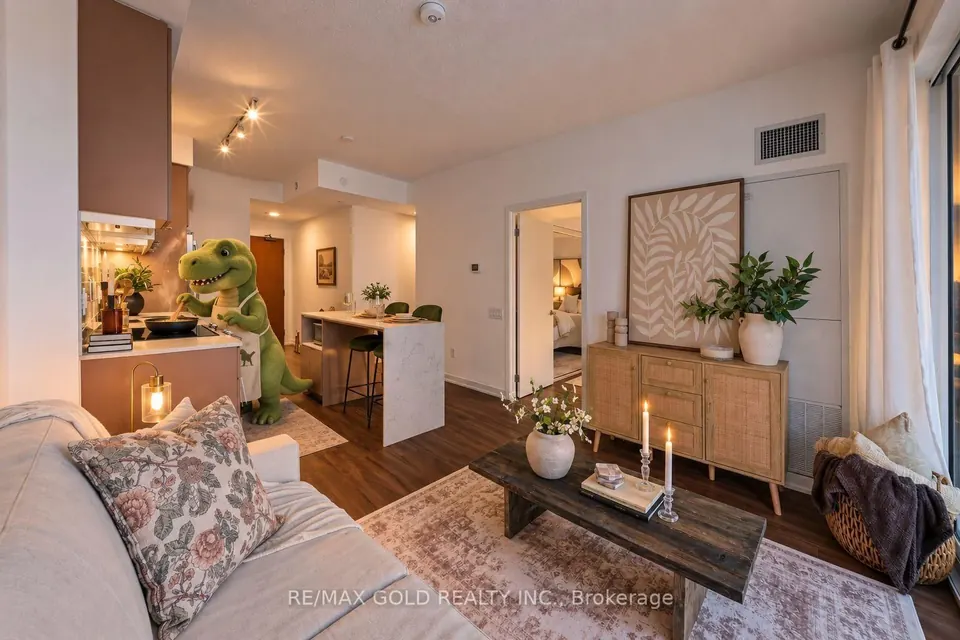 Condo living room with a patterned rug and a wood console