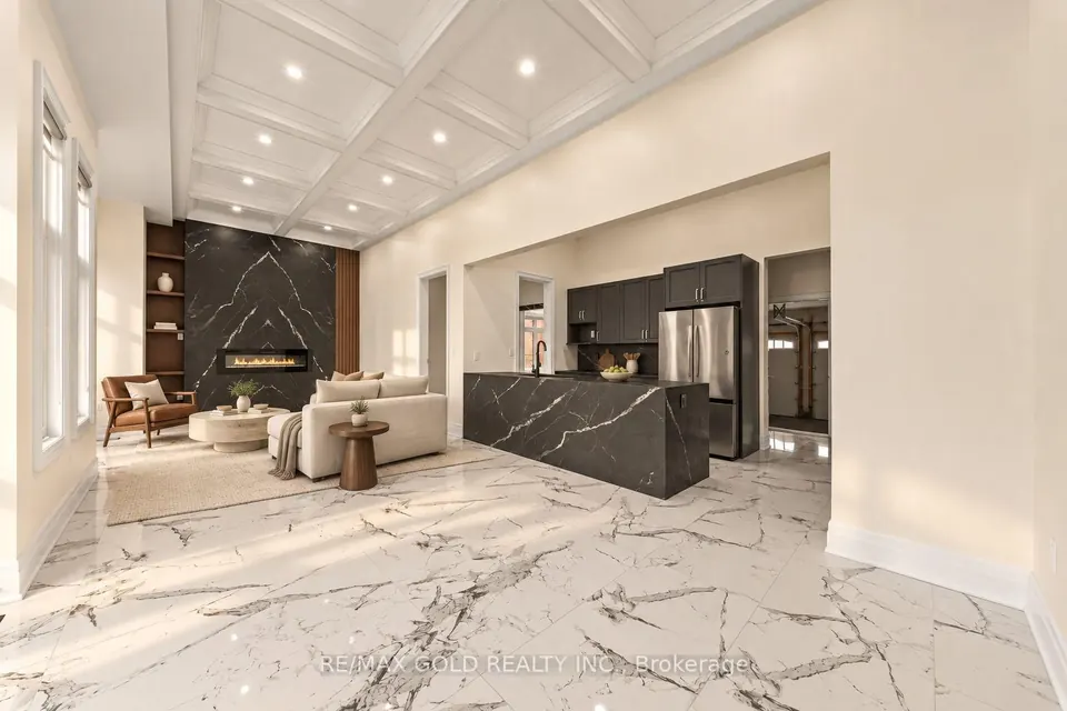 Open main floor with a marble kitchen island and fireplace